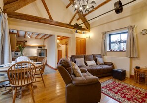 living room with high beamed ceilings