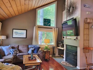 Living room with fireplace and flat screen TV