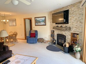 Living area with fireplace and TV