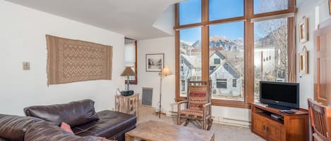 Living room with a flat-screen tv and a leather couch