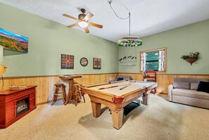 Majestic Hollow Game Room with Pool Table and 2 chairs that make into twin beds