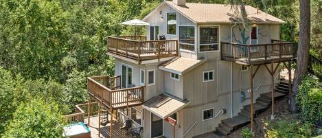 Multiple decks with forest views.