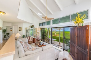 Nicely furnished living room with golf course and ocean views