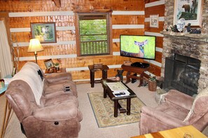 Comfortable living room with a loveseat and recliner