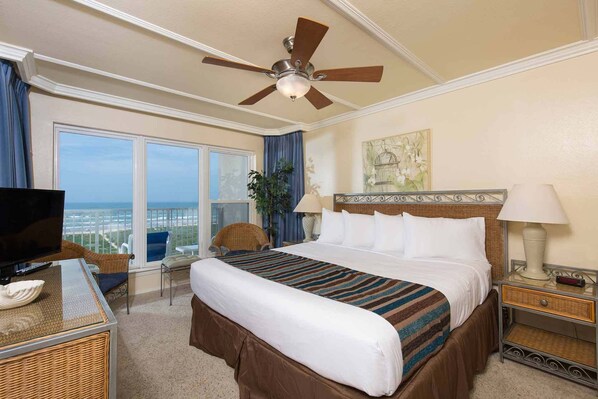 The primary bedroom has a king-size bed and an amazing view!