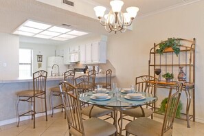 Our dining area seats 8 with 4 around the table plus 4 at the breakfast bar.