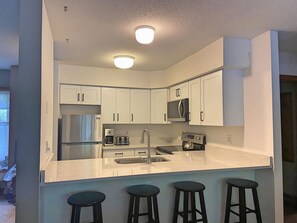 Bright kitchen with 4 stools