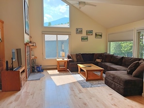 Living area with comfy seating and mountain views