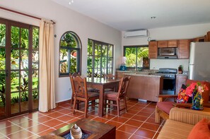 Dining area and Living room - Open, sunny great room. Open the large french doors and let in the breeze.