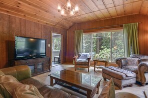 Open living room with flatscreen TV.