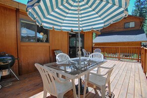 Back porch with patio furniture. Charcoal grill has been replaced with Electric grill due to open flame ban