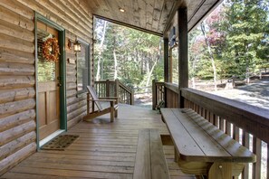 The front porch has a small picnic bench where you can enjoy a snack.