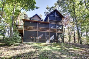 View of the screened porches in the back of the cabin.