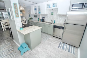 Kitchen with white & sage green cabinets