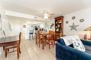 Our sunny living room reaches into the dining space - the perfect backdrop for movie and pizza night!
