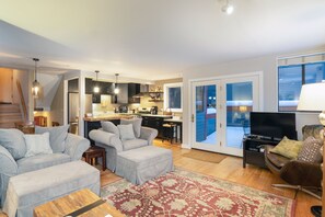 Living room with balcony access.