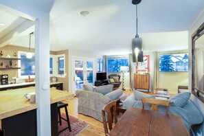 Open concept with over flow bar seating for meals/