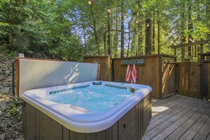 Or soak in the hot tub under the trees.