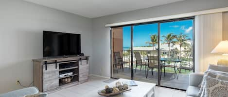 Beautiful blue skies and palm trees viewed from the living room.