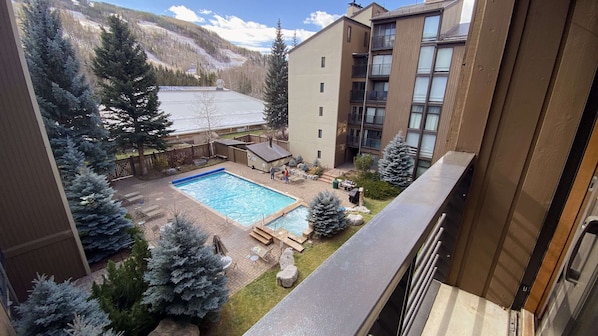View to the pool from the bedroom with a King and Queen