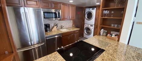 Full size washer and dryer located in the entry way.