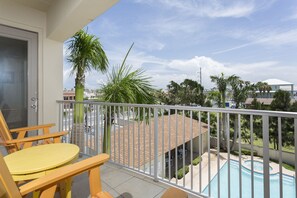 Enjoy the view of the pool from our balcony.