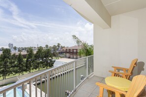 Enjoy a cool beverage on the balcony with a friend.