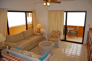 Living Room - The living room opens to the beachfront terrace and has ocean views.