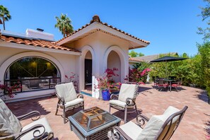 Once inside the courtyard there is an outdoor firepit and dining table