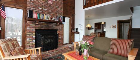 Enjoy the large brick electric fireplace after long days on the slops or to add some ambiance for your family and guests