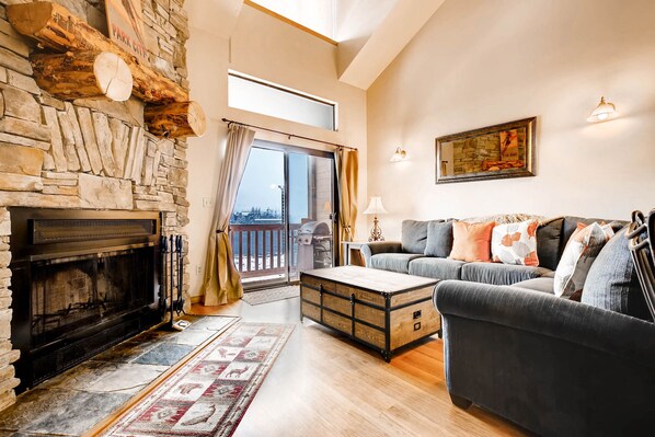 Cozy wood burning fireplace - ParkCityLodging_PowderPointe303B_LivingRoom (2)