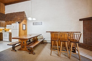 Dining table and extra seating at the bar.