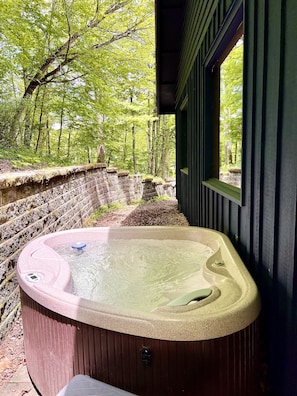 Enjoy a soak in a secluded hot tub 
