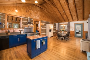 The huge kitchen features a copper topped island 