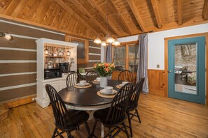The dining room features a custom coffee bar and dining for 6