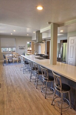 Seating for 6 at the expansive island in addition to the dining room table