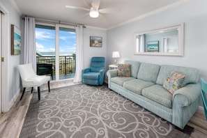 Living room with recliner and balcony access