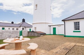Ariel, Nash Point Lighthouse:  Fully enclosed garden with stone garden furniture