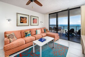 Sectional couch living room with balcony access