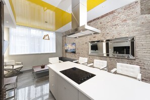 kitchen and living room with brick wall with a nice and clean design