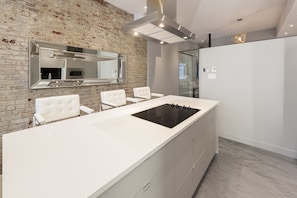 Kitchen island with cooking top.