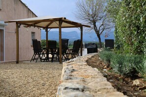 outdoor table and chairs with covered area