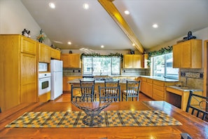 Upstairs Kitchen with Island and Dining