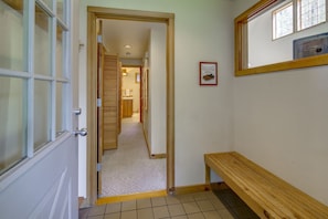 An entry way for skis, shoes, and coats