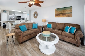 Livingroom - Soothing coastal tones create the ultimate family room.  Comfortable Sofa (with sleeper) and loveseat