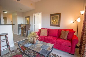 Living room with Queen size sleep sofa and a leather recliner