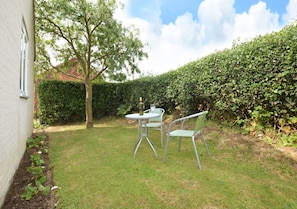 Garden with bistro table and chairs - lovely to sit out on a sunny day!