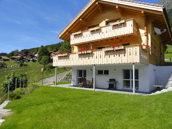 Sheltered garden terrace with gas barbecue