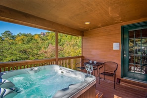 Sip wine and watch sunset over the mountains from the 4 person hot tub