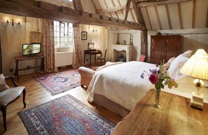 First floor: Spacious 6' Super King double bedroom with views over the Cloister Garden and quince trees